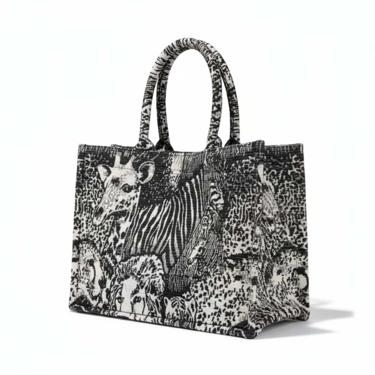 Handcrafted jacquard fabric tote bag with a luxury black and white safari animals design.