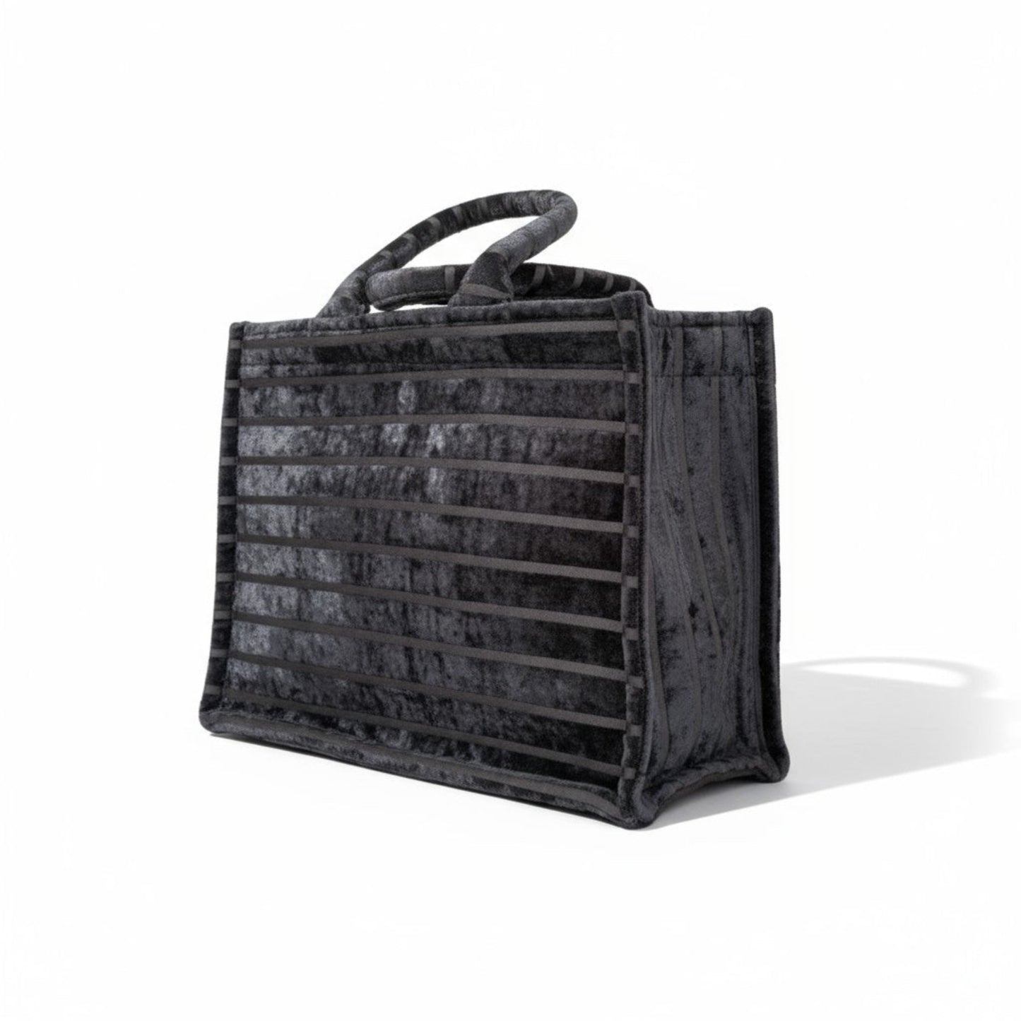 Book Tote Black Chenille handbag, luxury striped top handle tote bag shown side view.