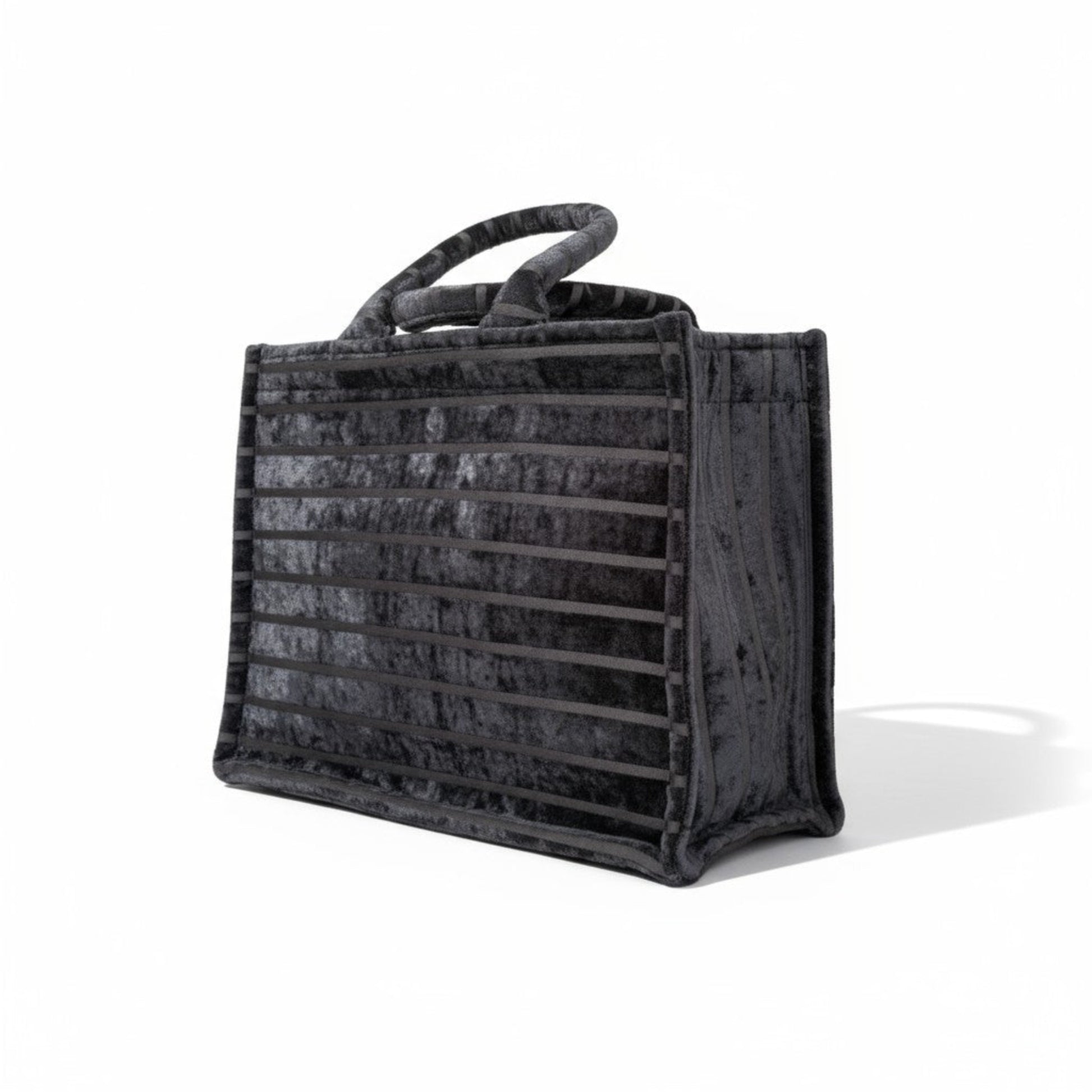 Book Tote Black Chenille handbag, luxury striped top handle tote bag shown side view.