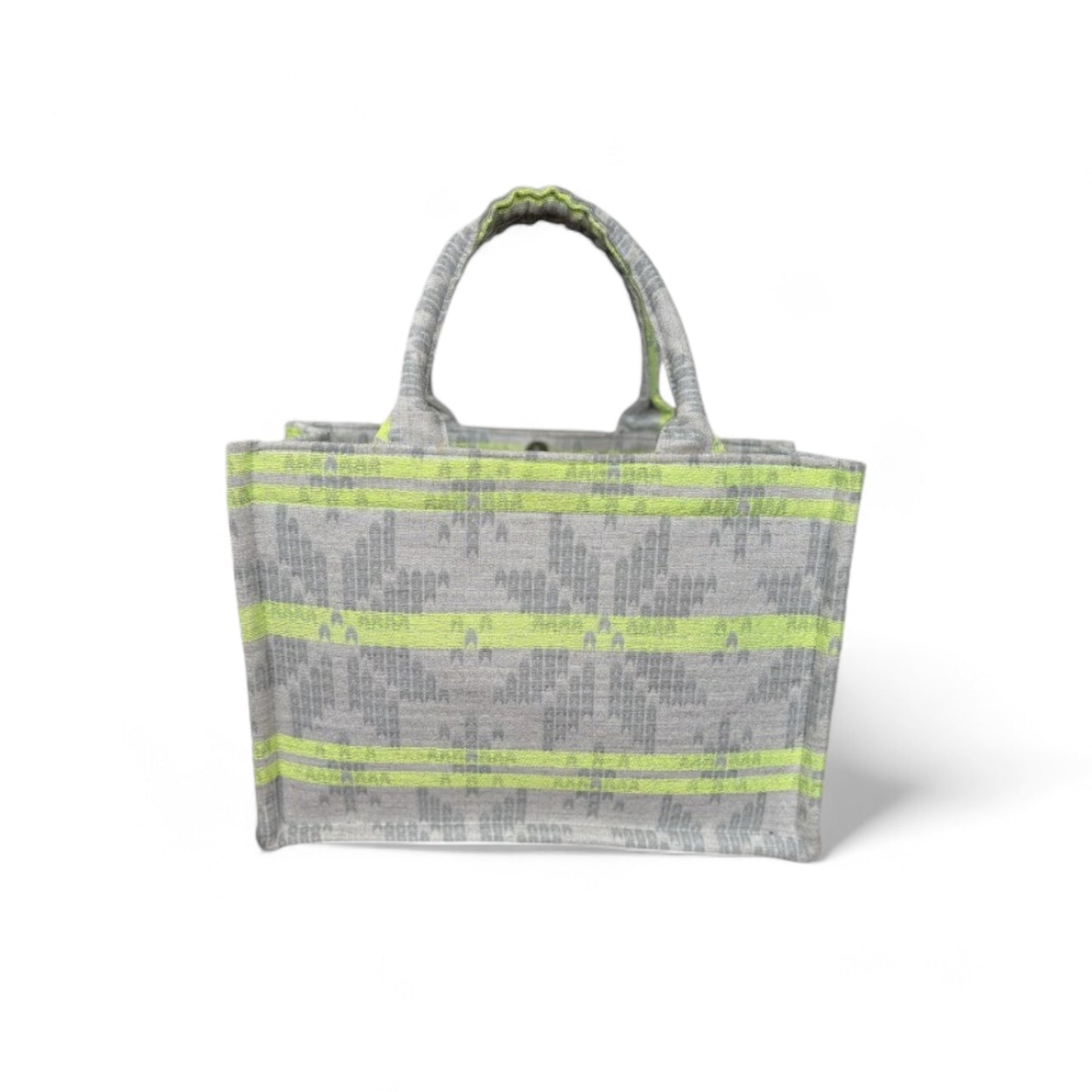 A tote bag with neon green stripes on light grey jacquard fabric.