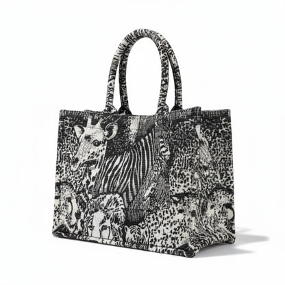 Handcrafted jacquard fabric tote bag with a luxury black and white safari animals design.