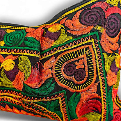 An orange multi-colour embroidered fabric featuring detailed floral and bird patterns.