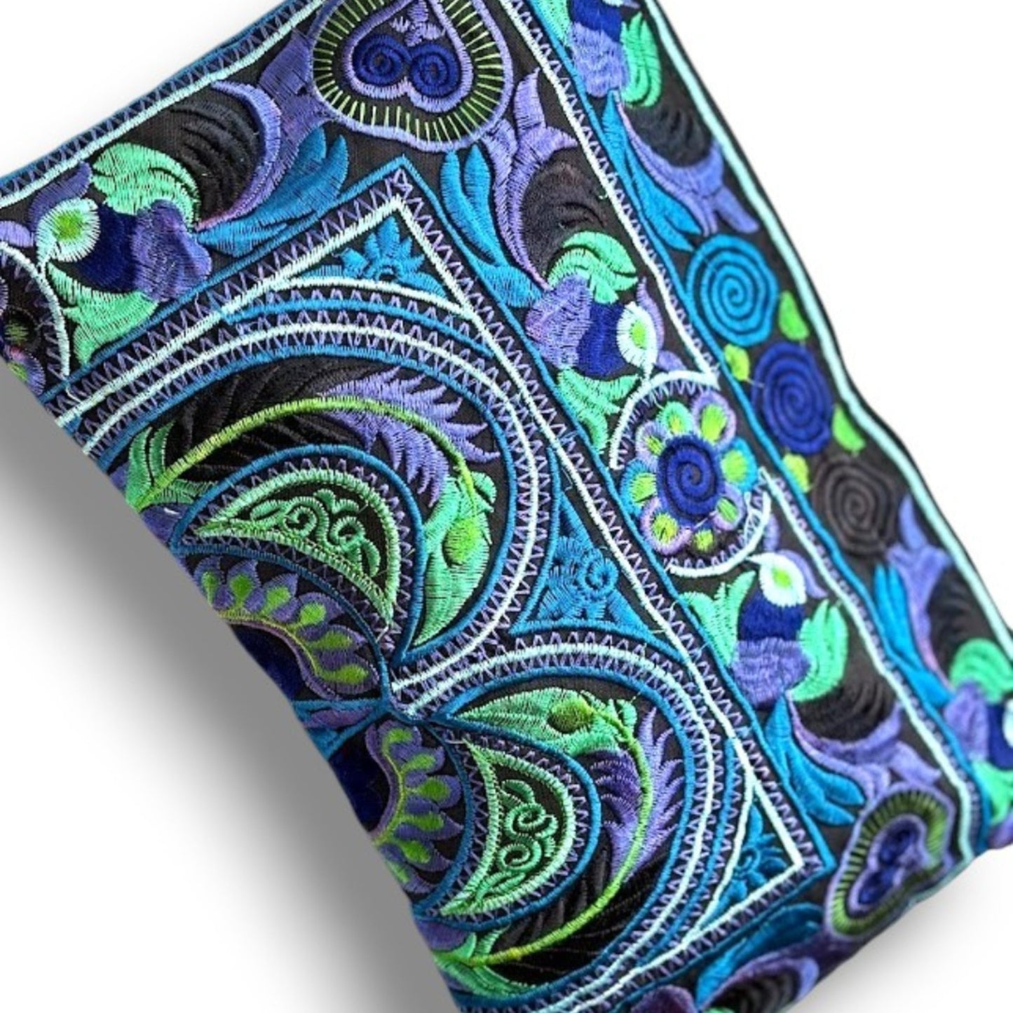 Close-up of Hmong embroidered bag in sky blue and green with unique bird & floral patterns.