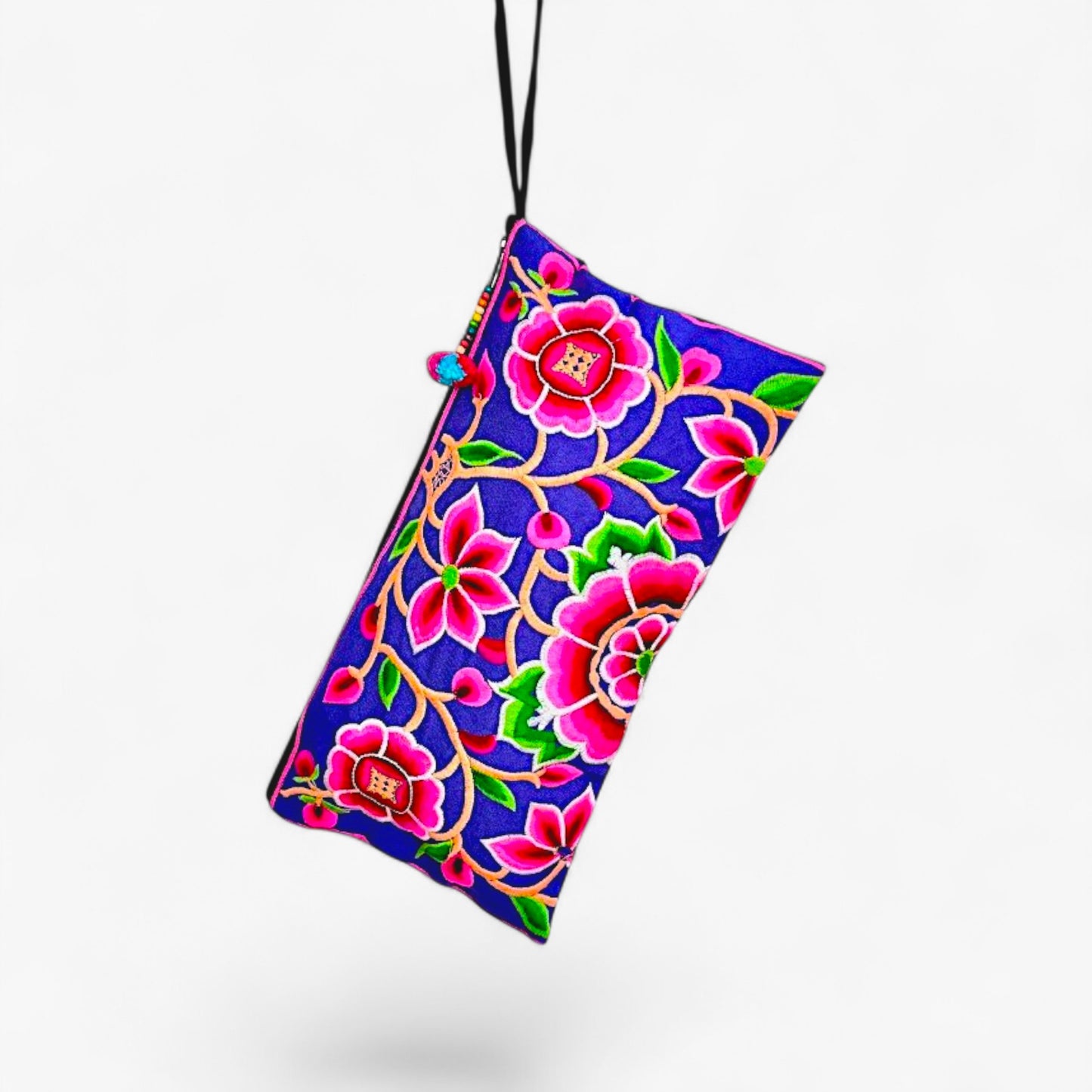 A vibrant wristlet clutch featuring Hmong peony embroidery in pink, with a wrist strap on the back.