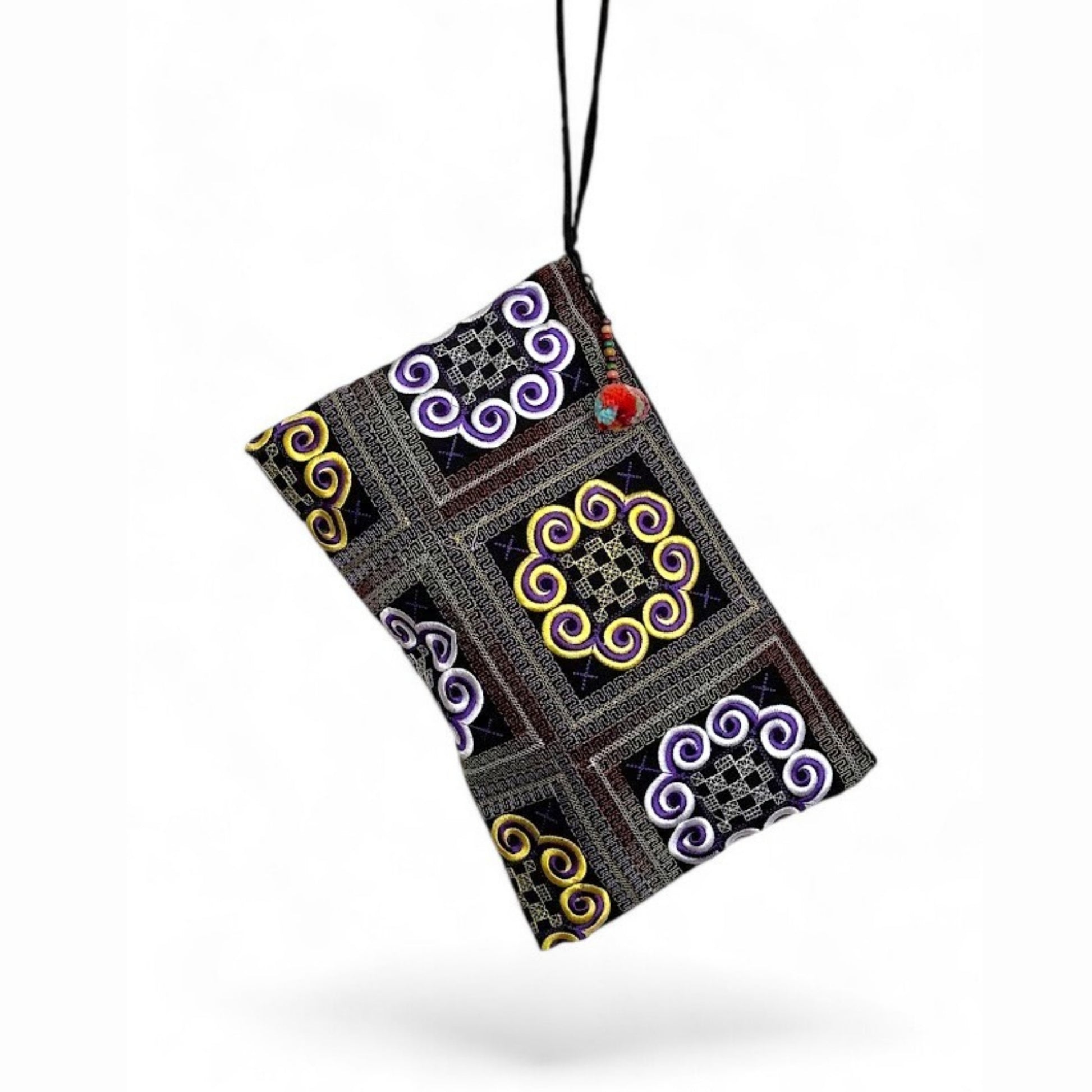 A handmade traditional Hmong embroidery bag with a wrist strap and mini pom-pom.