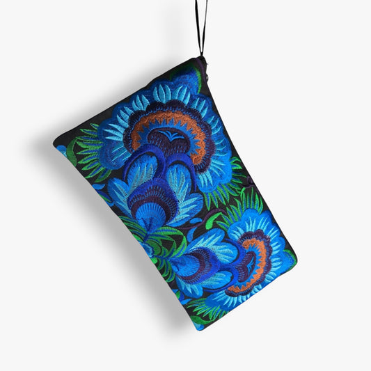 Hanging embroidered blue flowers wristlet with green accents on black fabric.