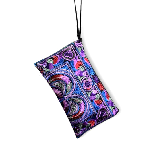 Purple, red, and blue embroidered bird and floral patterned on a black wristlet clutch with a strap.