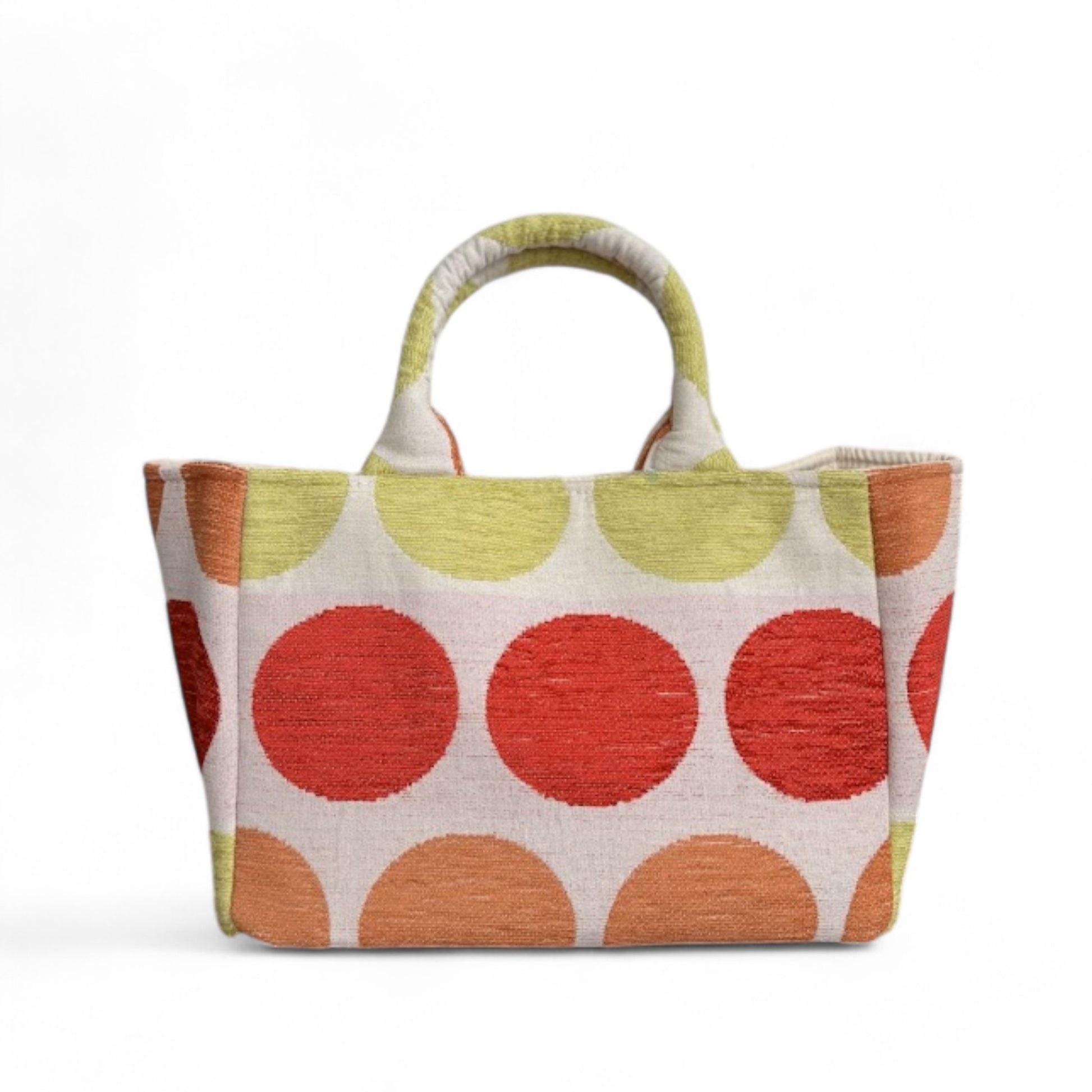 Front view of a mini tote featuring red, green, and orange dots on beige fabric, with expanded side panels.