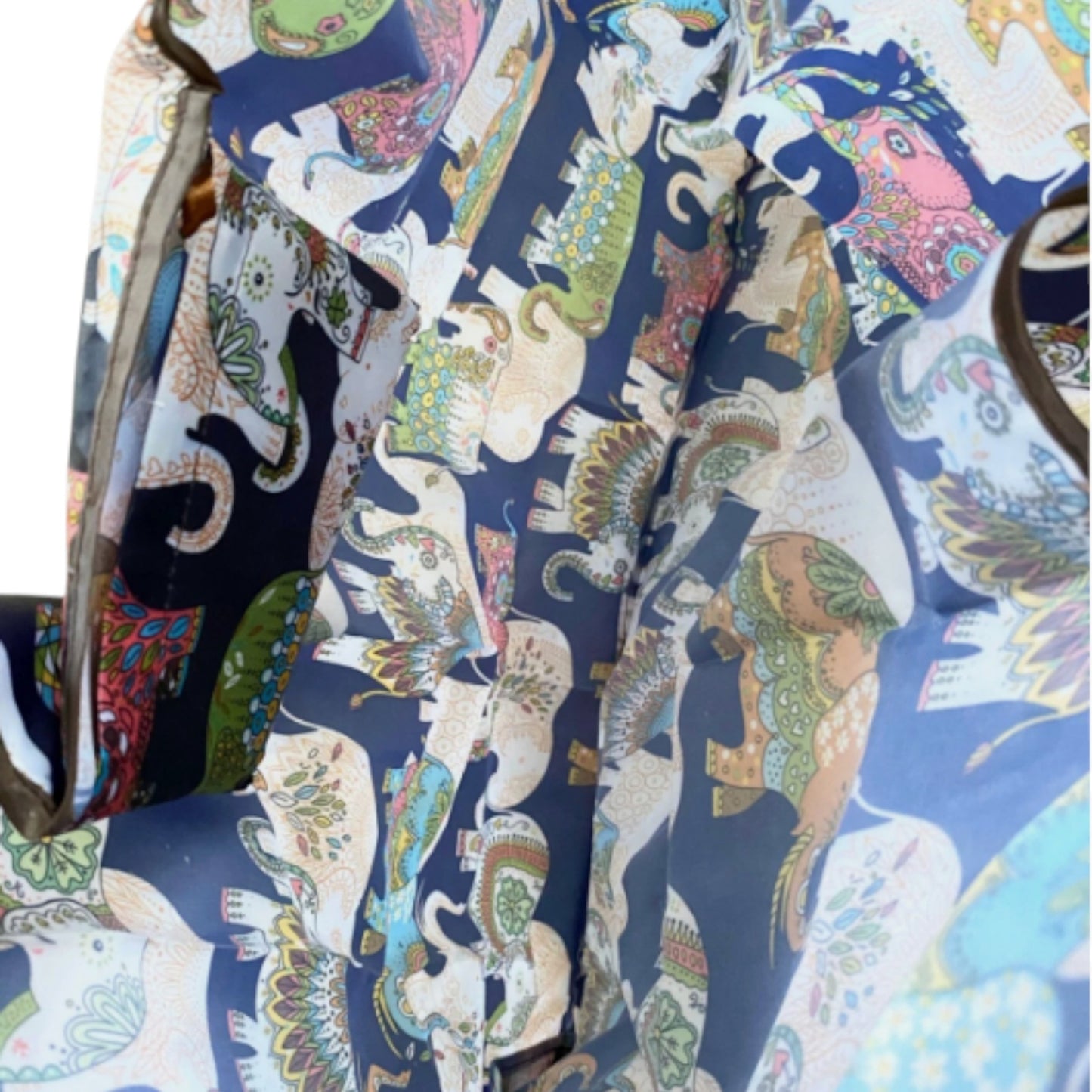 Inside of a navy nylon tote bag with colourful elephant paterns.