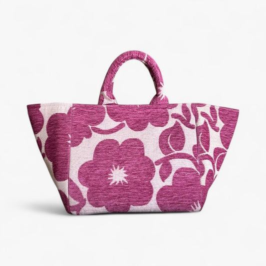 A front view of textured Magenta Bloom Shopper Bag with its bold floral pattern, handles, and large capacity.