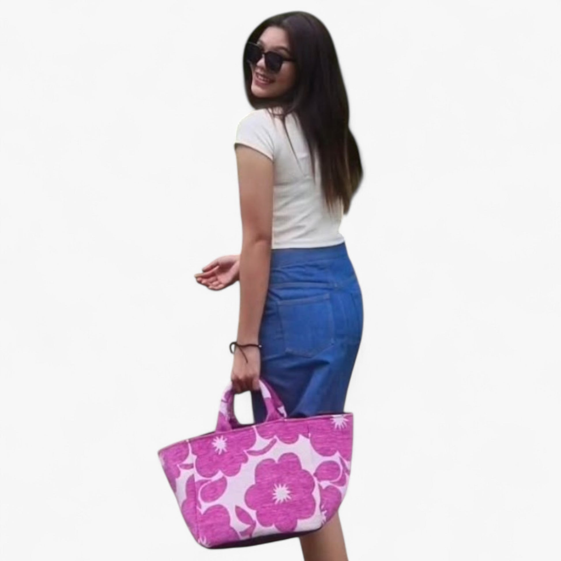 A woman holding the magenta floral shopper bag, highlighting its size and style.