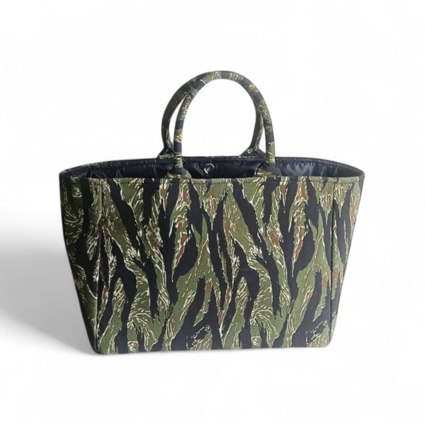 Top view of a  black and green camouflage tote bag with black lining.