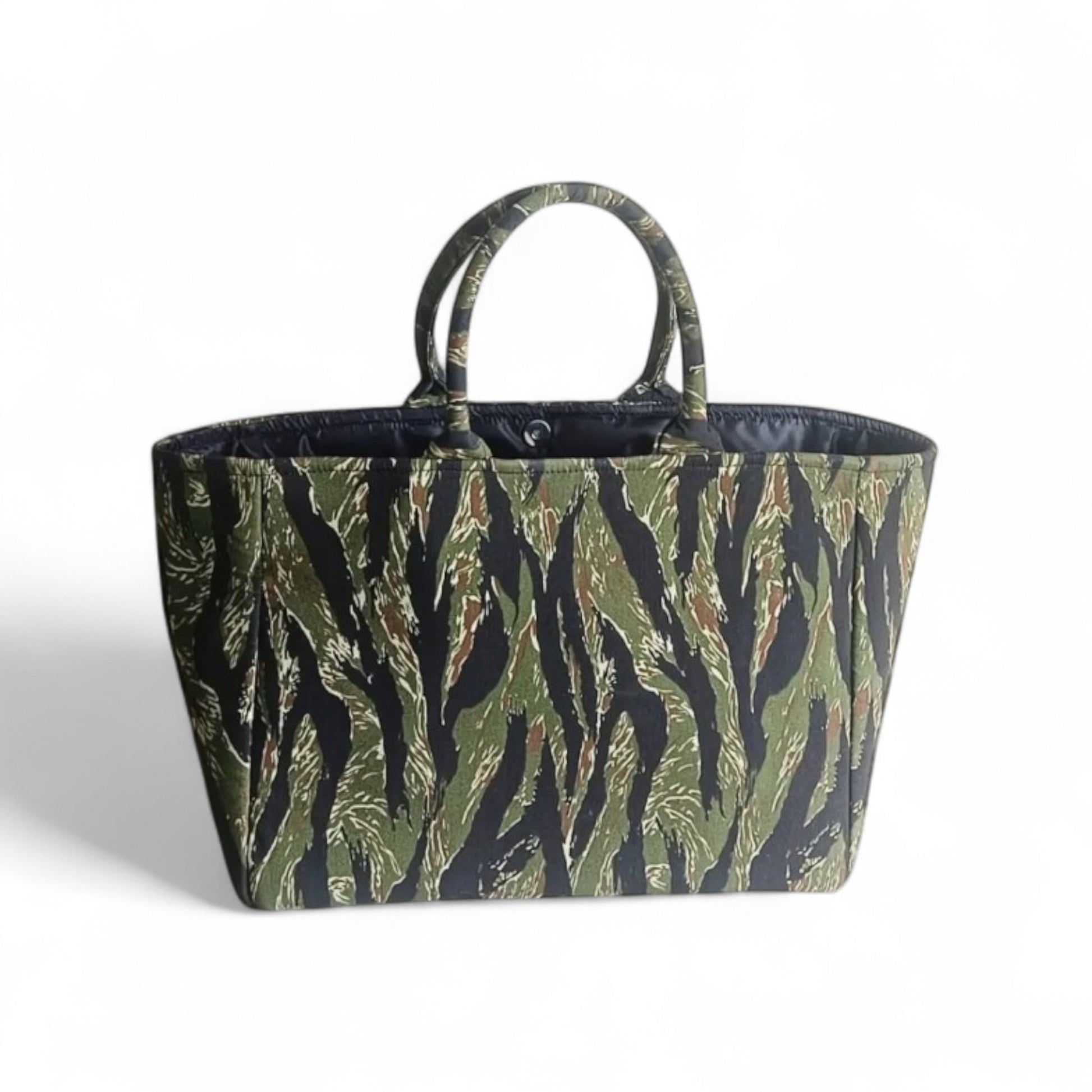 Top view of a  black and green camouflage tote bag with black lining.