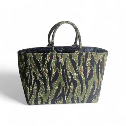 Top view of a  black and green camouflage tote bag with black lining.