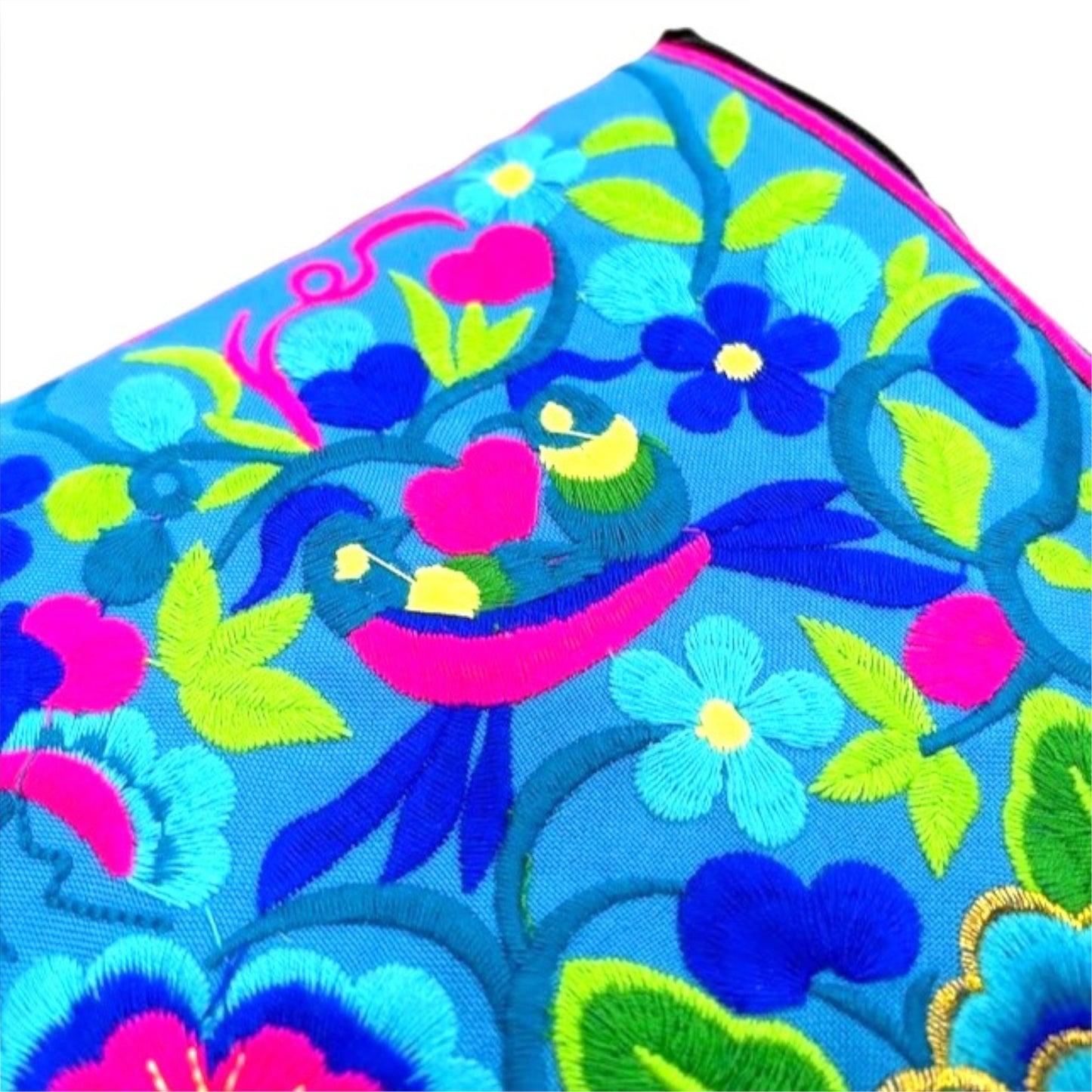 Embroidered fabric with birds and flower patterns in blue, pink, and green.